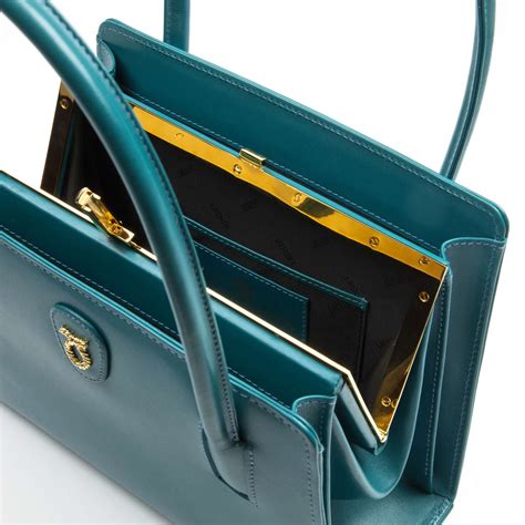 queen elizabeth launer handbags.